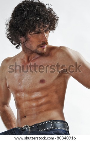 semi nude portraits of a handsome muscular man isolated on white in studio