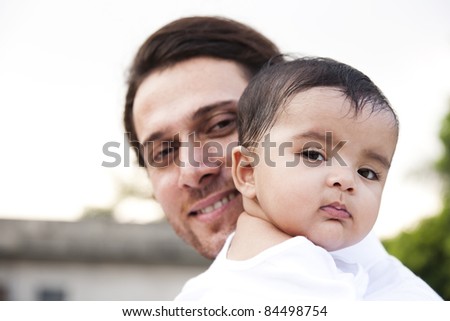 Indian baby girl and a caucasian father, biracial ethnic family.