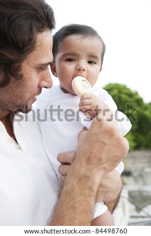 Indian baby girl and a caucasian father, biracial ethnic family.