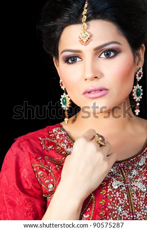 stock photo Muslim Indian bride wearing a red bridal dress portrait of a 