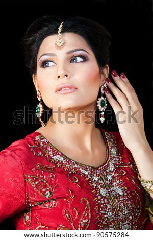 Muslim Indian bride wearing a red bridal dress, portrait of a beautiful Indian bride