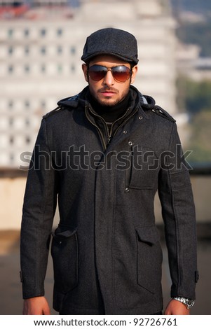 portrait of a handsome young man with attitude, portrait of a handsome man wearing jacket and sunglasses
