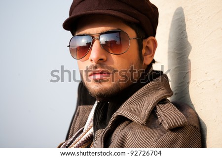 portrait of a handsome young man with attitude, portrait of a handsome man wearing jacket and sunglasses