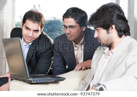 group of multi ethnic businessmen, indian businessman in a meeting with his colleagues