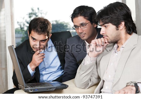 group of multi ethnic businessmen, indian businessman in a meeting with his colleagues