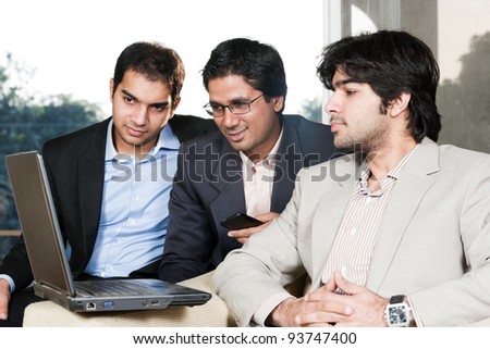 group of multi ethnic businessmen, indian businessman in a meeting with his colleagues