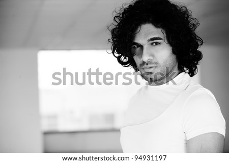 portrait of a confident man with afro hair style,