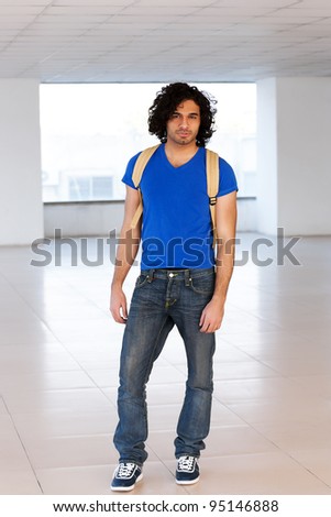 male university student with back pack.