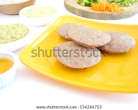Cakes made from steam-cooking finger millet flour batter.