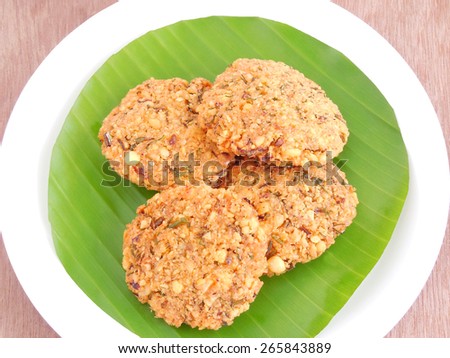 Masala vada, a popular Indian vegetarian snack, made from deep-frying portions of lentil batter.