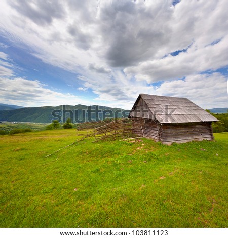 Old barn in the mountains at summer