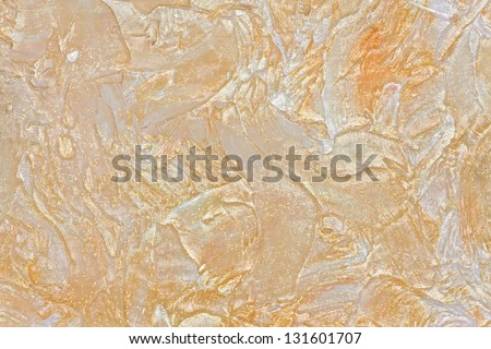 large texture of wall painted beige with gloss and glitter