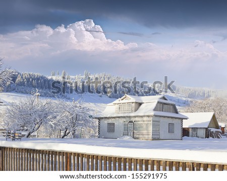 A sunny landscape in the village. Winter morning.
