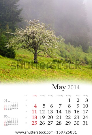 2014 Calendar. May. Blooming apple trees in the mountains in spring