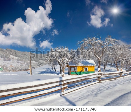 Sunny landscape in the mountain village.