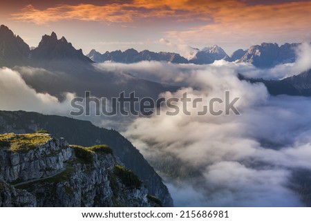 Foggy summer sunrise in the Italian Alps. Dolomites mountains, Italy, Europe.