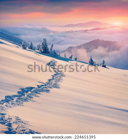 Beautiful winter sunrise in the mountains. Retro style.