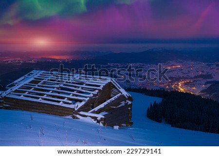Northern lights in the winter mountains