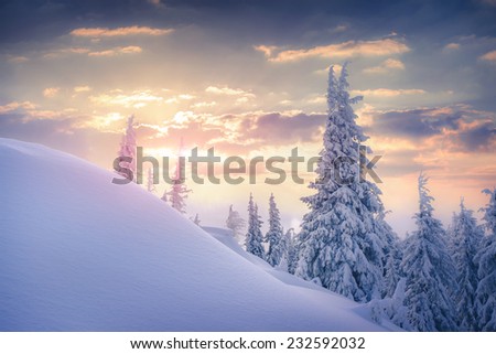 Beautiful winter sunrise in the mountains. Retro style.