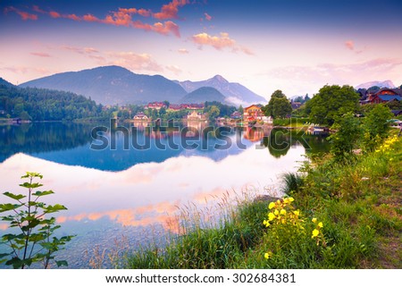 Colorful summer morning on the Grundlsee. Archkogl village in the morning moist. Alps, Austria, Europe.
