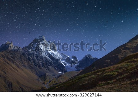 Night view of Mt. Ushba in Caucasus mountains. Upper Svaneti, Main Caucasus ridge, Georgia, Europe. October 2015.
