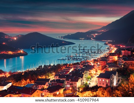 View from the bird's eye of the Kas city, district of Antalya Province of Turkey, Asia. Colorful spring sunset in small Mediterranean yachting and tourist town.