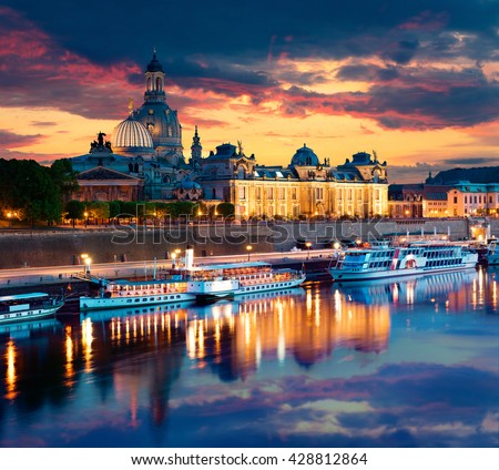 Evennig view of Academy of Fine Arts and Baroque church Frauenkirche cathedral. Colorful sunset on Elbe river in Dresden,  Saxony, Germany, Europe. Artistic style post processed photo.