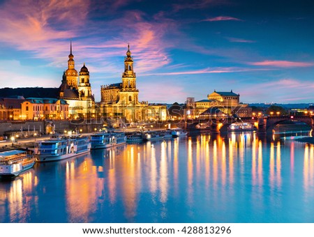 Evennig view of  Cathedral of the Holy Trinity or Hofkirche, Bruehl\'s Terrace or The Balcony of Europe. Colorful sunset on Elbe river in Dresden, Saxony, Germany, Europe.