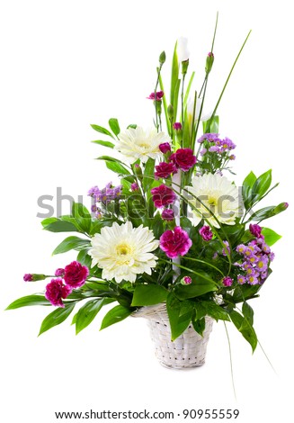 Bright flower bouquet in basket isolated over white background