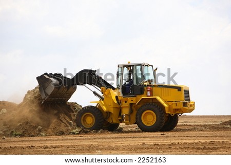 Front end loader clearing a construction site