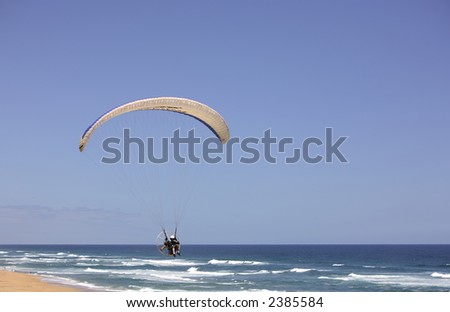 Para gliding on the beach