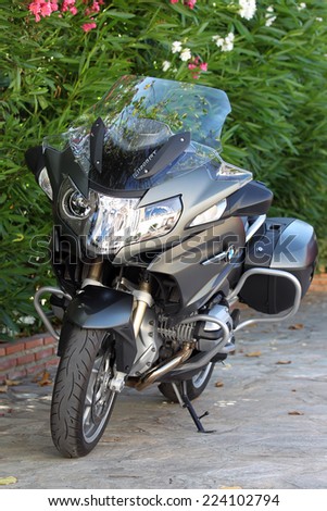 MARBELLA, SPAIN - SEPTEMBER 9, 2014: New, post recall, BMW R1200RT WC with new ESA suspension fitted. German crash bars installed.