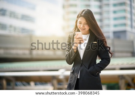 Young business woman calling on the cell phone
