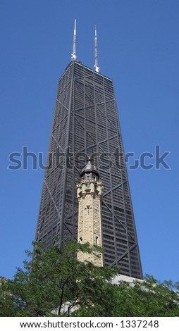 130-year-old water tower in front of John Hancock Bldg in Chicago