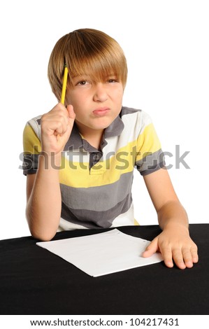 Concentrating on Homework. Young boy intensely thinking about a homework assignment or test question.
