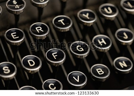 Typewriter keys. Angled shot of keys on an antique typewriter. Shallow DOF.