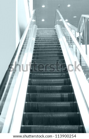 Empty escalator steps on staircase in the airport