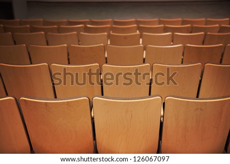 Empty  brown chairs in the cinema cinema