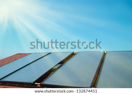 Solar water heating panels on the red roof Gelio system Solar water heating panels on the red roof Gelio system