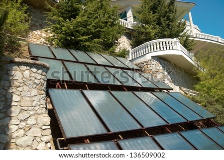 Solar system- green energy. A lot of panels in rows