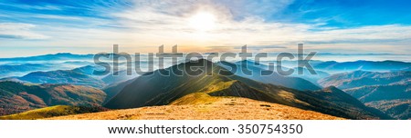 Mountain landscape at sunset. Panorama of beautiful view on hills