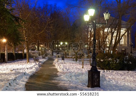 City night scene with lights and snow