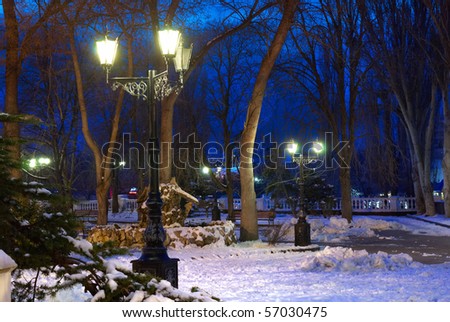 City night scene with lights and snow