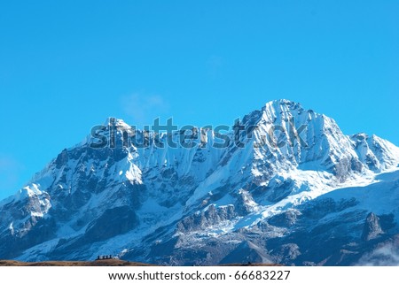 Top of High mountains, covered by snow. Kangchenjunga, India.