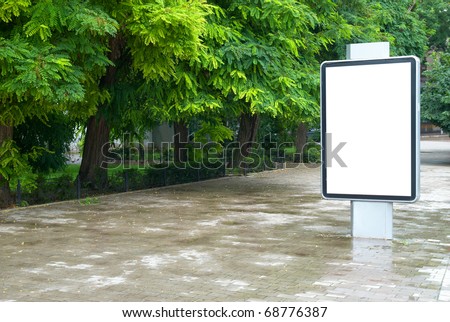 Vertical blank billboard on the city street
