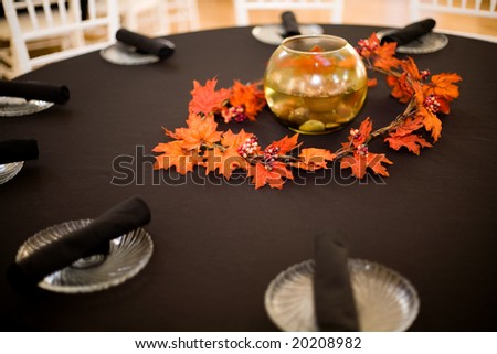 stock photo table setting at a wedding with a fall theme