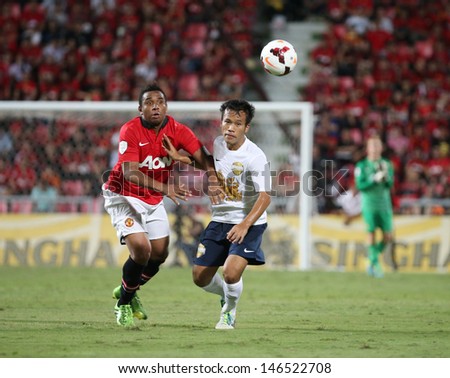 BANGKOK - JULY 13:Anderson (R) of Man Utd. fight for the ball in Singha 80th Anniversary Cup Manchester United vs Singha All Star at Rajamangala Stadium on July 13, 2013 in Bangkok, Thailand.