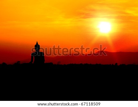buddha silhouette  on mountain with sunset background