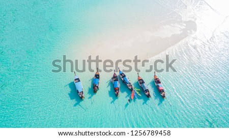 Top view or aerial view of Beautiful crystal clear water and white beach with long tail boats in summer of tropical island or Koh Lipe in Satun,Southern Thailand