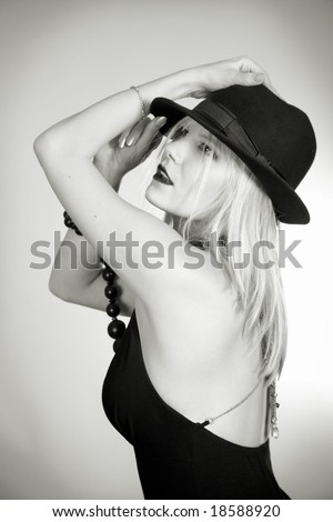 beauty girl in black hat over white
